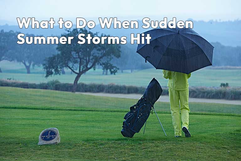 A person in yellow rain gear carries an umbrella and golf bag on a rainy golf course. Text: "What to Do When Sudden Summer Storms Hit.