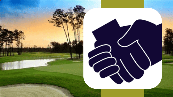 a hand shaking hands over a green golf course