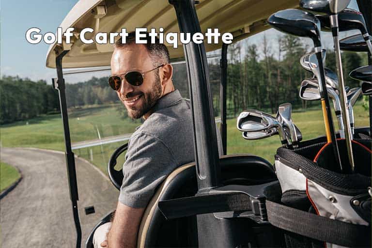 Man smiling in golf cart with clubs, on a course.